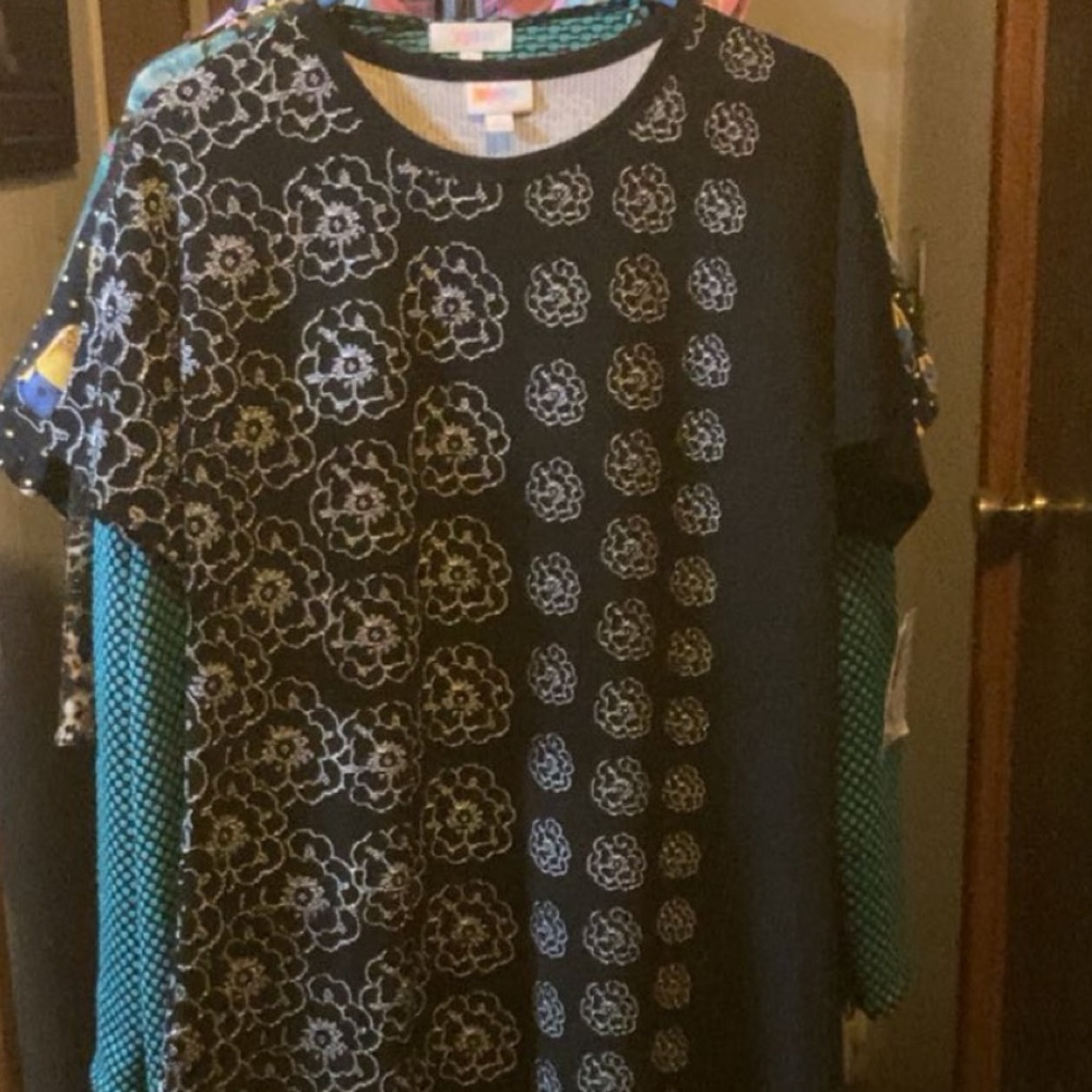 NWT Women’s Lularoe size L Stylish black dress with white floral patterns.
